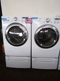 LG front load washer and dryer set with pedestals in excellent conditions
