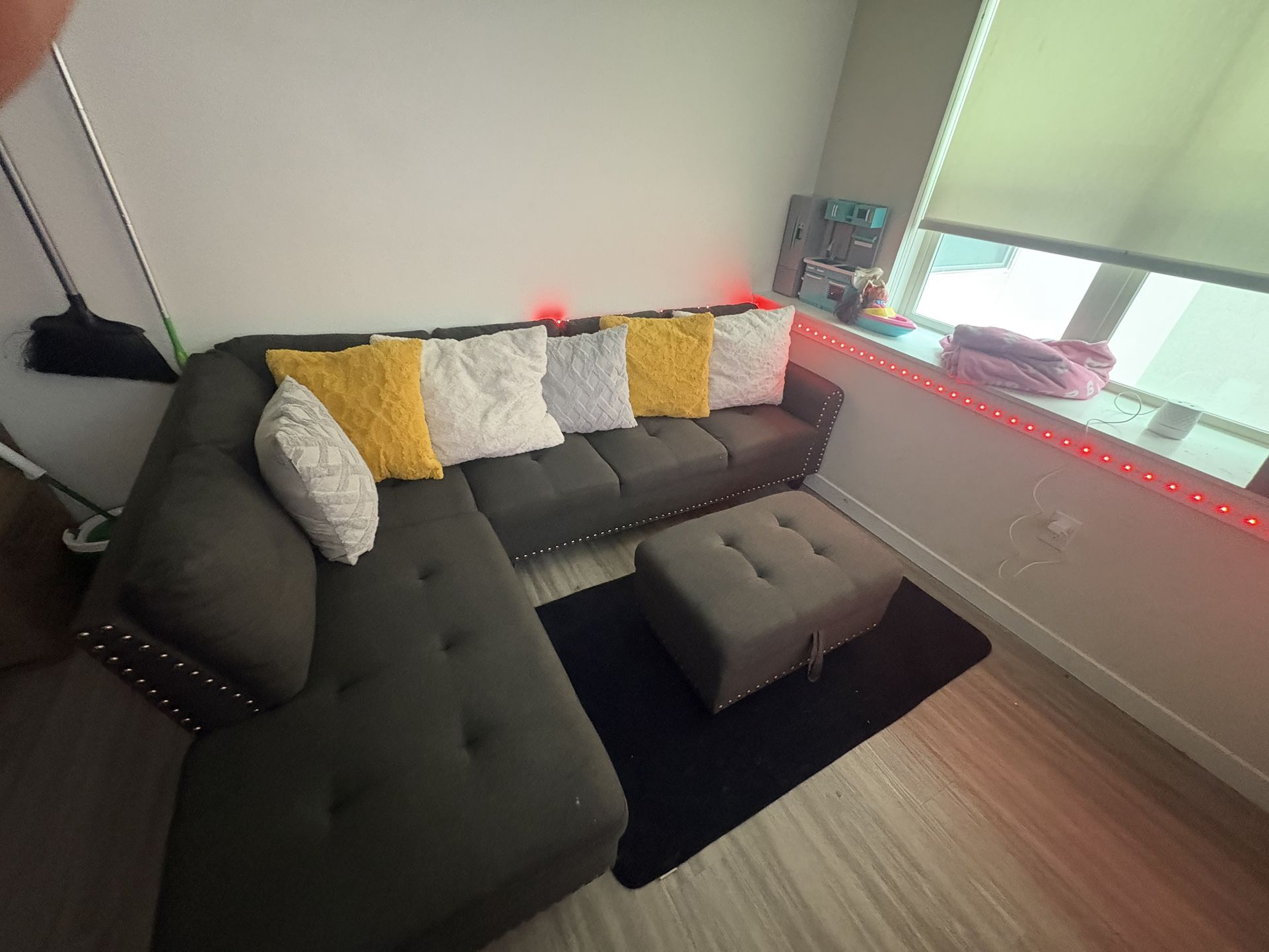 Gray sectional couch with ottoman