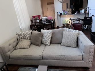 Grey sofas with cushions