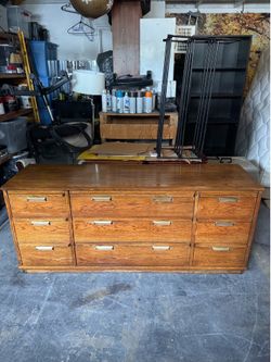 Vintage solid wood 9-drawer low boy dresser  19 deep x 88L x 30 H.