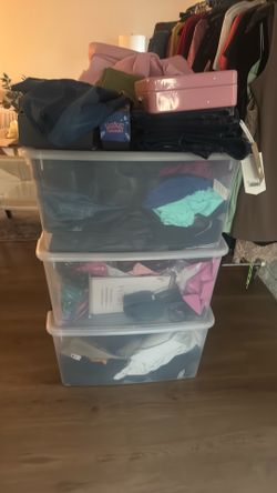 Fashion clothes for sale with three dollars each piece in the bins