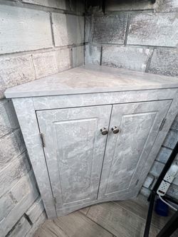 MOVING SALE EVERYTHING MUST GO! Faux marble corner cabinet