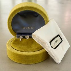 Authentic Gucci Asymmetric Heart & Triangle (Spike) Earrings in 18K white gold with a diamond accent.