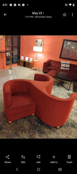 Vintage red tête-à-tête chair.