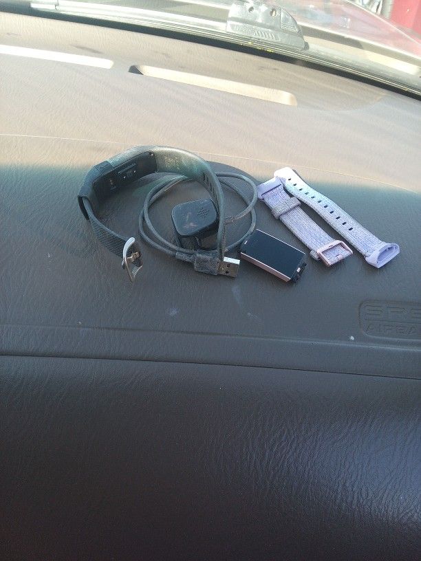 2 Fitbits With Charger