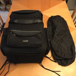 NEW Motorcycle Tourmaster giant travel sissy-bar motorcycle luggage bag (Never Used) It has two front compartments and 4 side compartments.