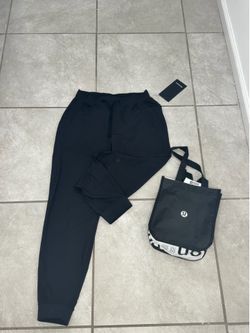 Brand new Lululemon black pants with bag
