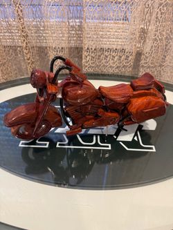 This is a handcrafted wooden model of a Harley-Davidson motorcycle (resembling a Road King or cruiser style) made from polished mahogany wood.