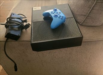 Xbox one with one controller and power cord.