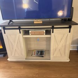 Ashley Dorrinson Farmhouse Barn Door TV Stand  $80