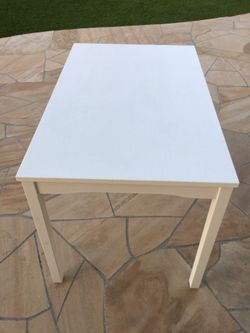 White dinning table with chairs