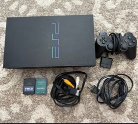 PlayStation 2 with 2 controllers comes with games in memory disk