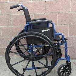 Drive Medical Blue Streak Wheelchair with Flip Back Desk Arms.