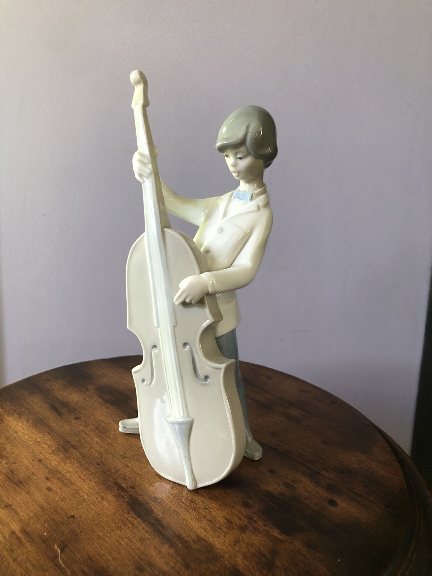 Lladro Boy with double bass. 9” tall