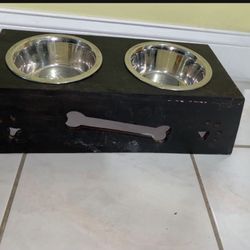 Raised wooden dog feeder One of the dishes has some rust $8  or Free with another purchase 