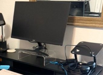 Black Acer monitor and lap top stand