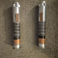 Pair of green lightsabers