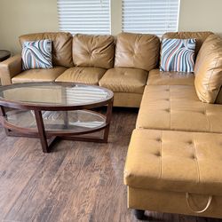 Sectional sofas with contemporary coffee table and side tables