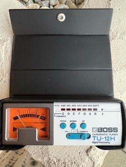Vintage Boss TU-12H High Range Chromatic Tuner with an analog meter and digital processing