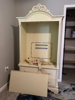 Cream Wood Armoire with Ornate Crown Detail
