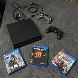 1 TB Ps4 Console, 2 Controllers And 3 Games/ Barley Used