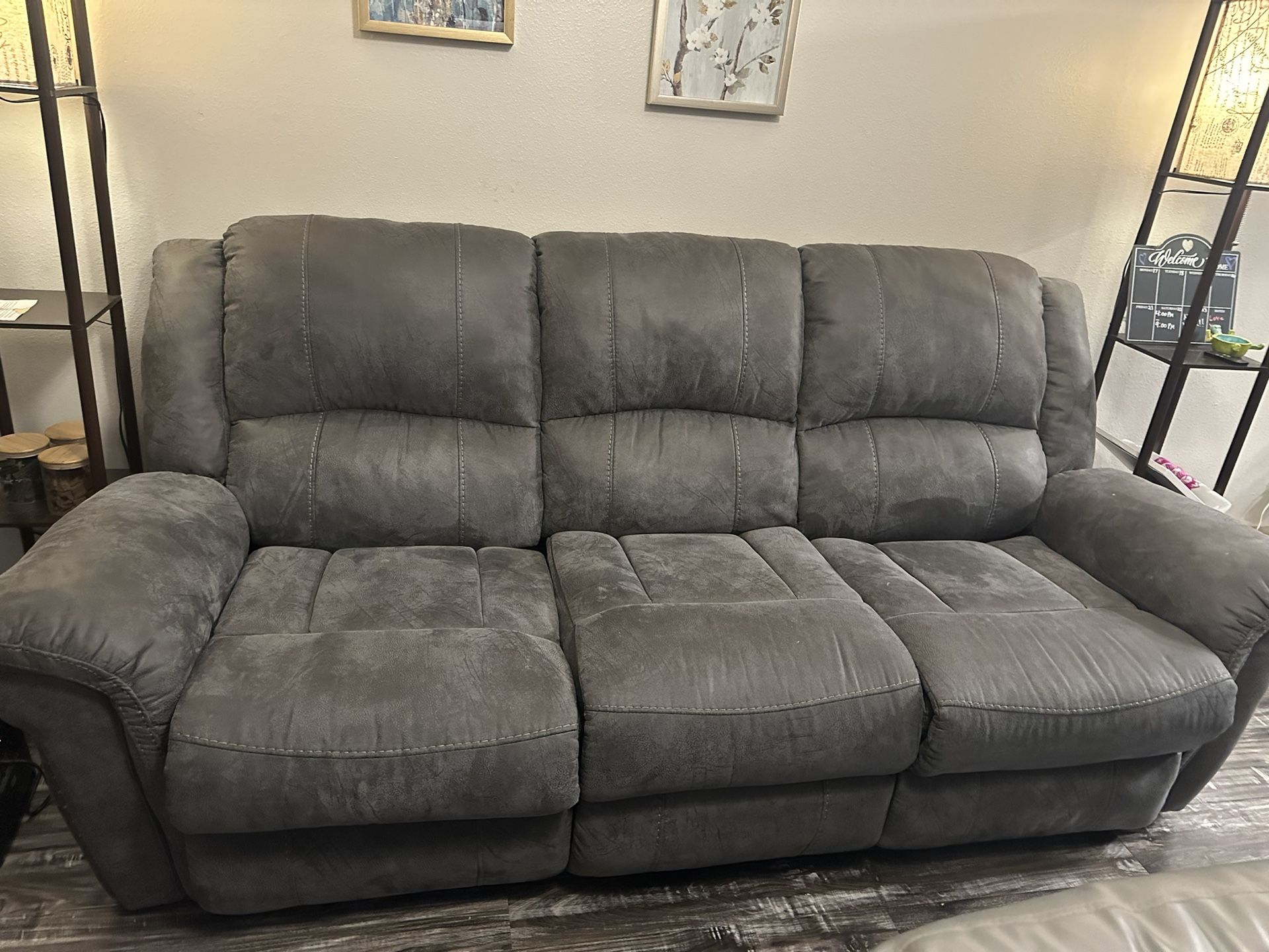 Grey couch with reclining sides