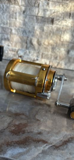 Gold PENN INTERNATIONAL 30SW TWO SPEED BIG GAME Fishing Reel with 135 lb Spectra.