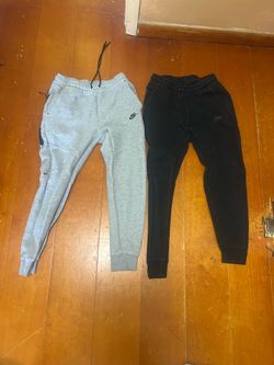 2 pairs of Nike tech sweatpants