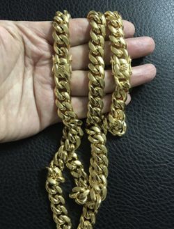 New 14 k yellow gold Cuban link chain and bracelet