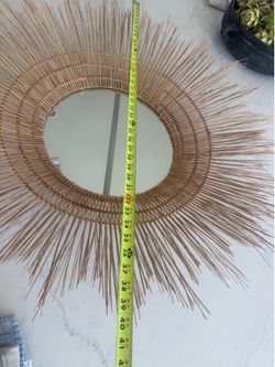 Large rattan wall mirror decoration.
