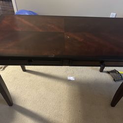 Sturdy brown study table in excellent condition — strong build, priced at $150.