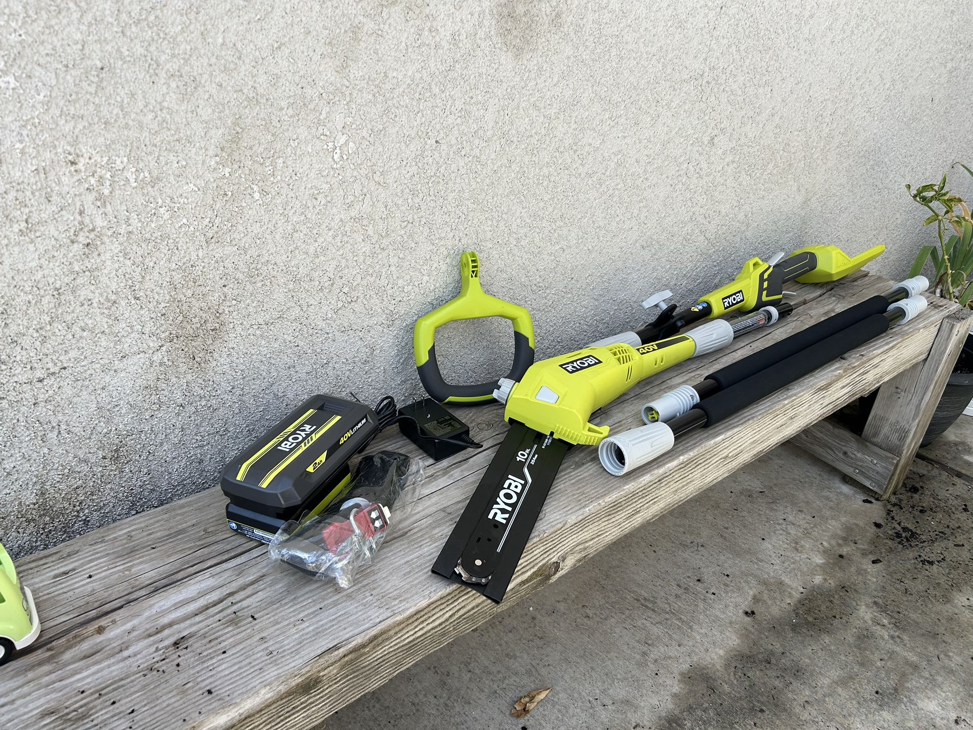 RYOBI 40V 10 in. Cordless Battery Chainsaw/Pole Saw with 2.0 Ah Battery and Charger