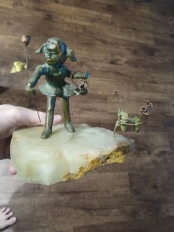 Bronze girl on stone
