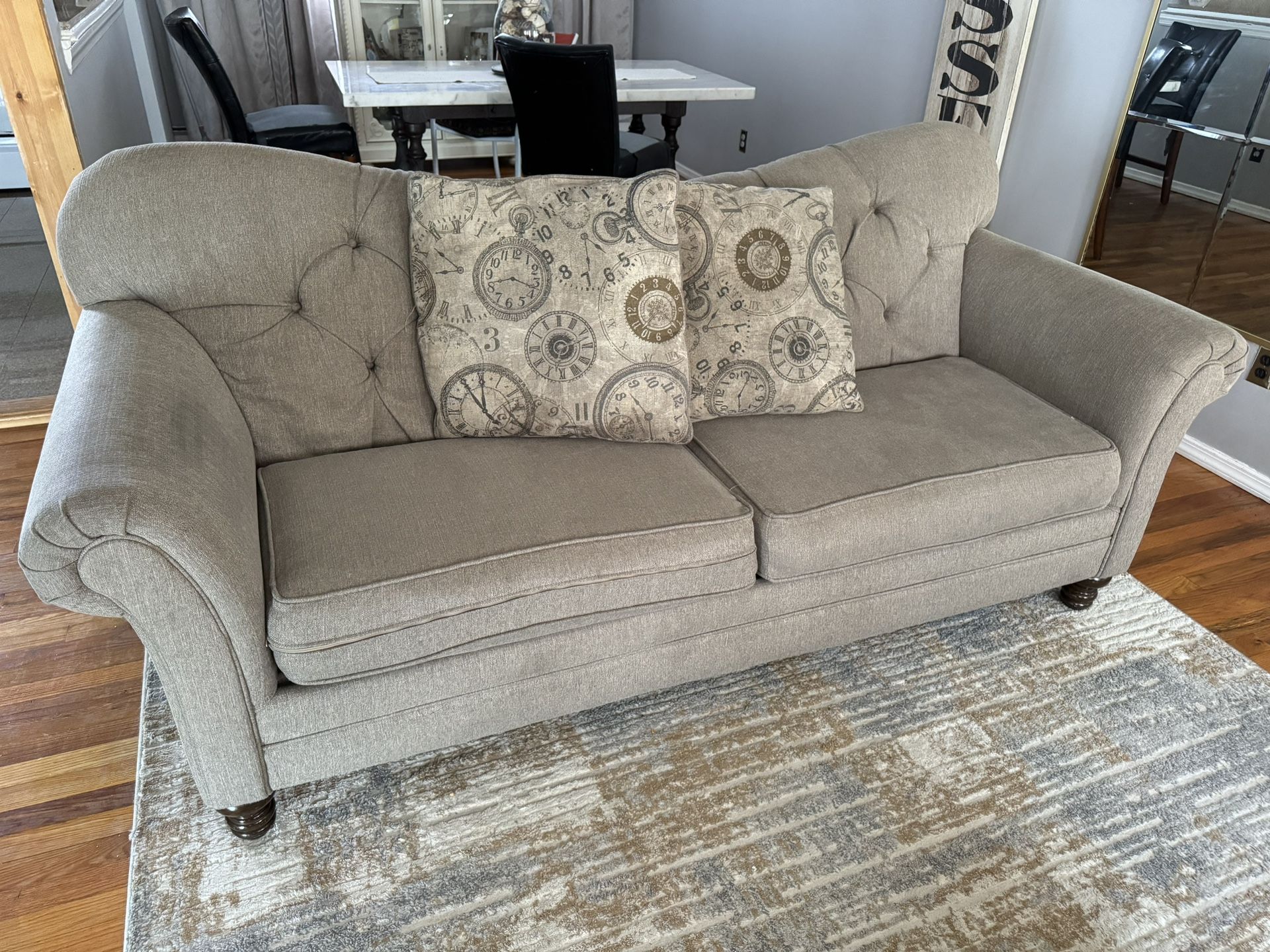 Sofa and loveseat with decorative pillows