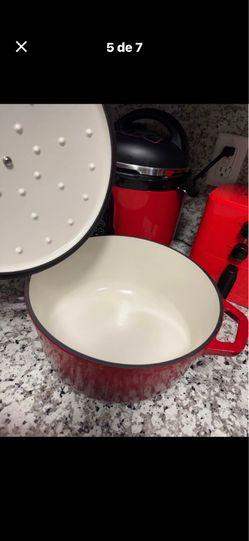 Two red cast iron pots