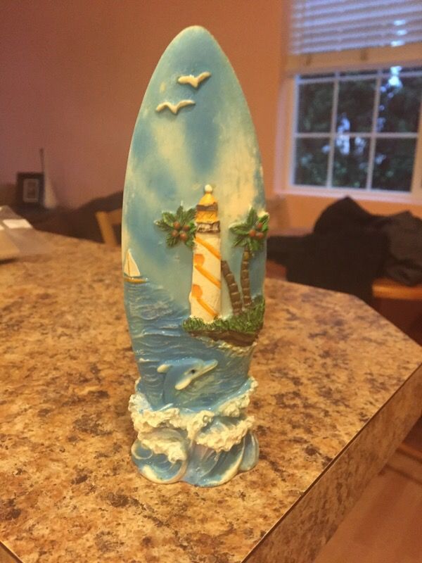 Hawaii dolphin surfboard lighthouse
