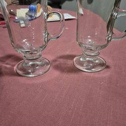 2 small glasses with handle.