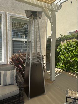 2 Patio heaters with propane tanks included