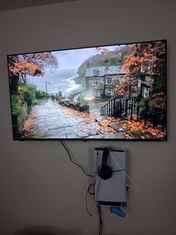 Ps5 disc edition and flat-screen TV with wall mounts