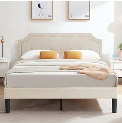 Full beige bed frame with mattress