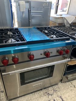 Wolf 36” slide in range with middle grill in stainless steel