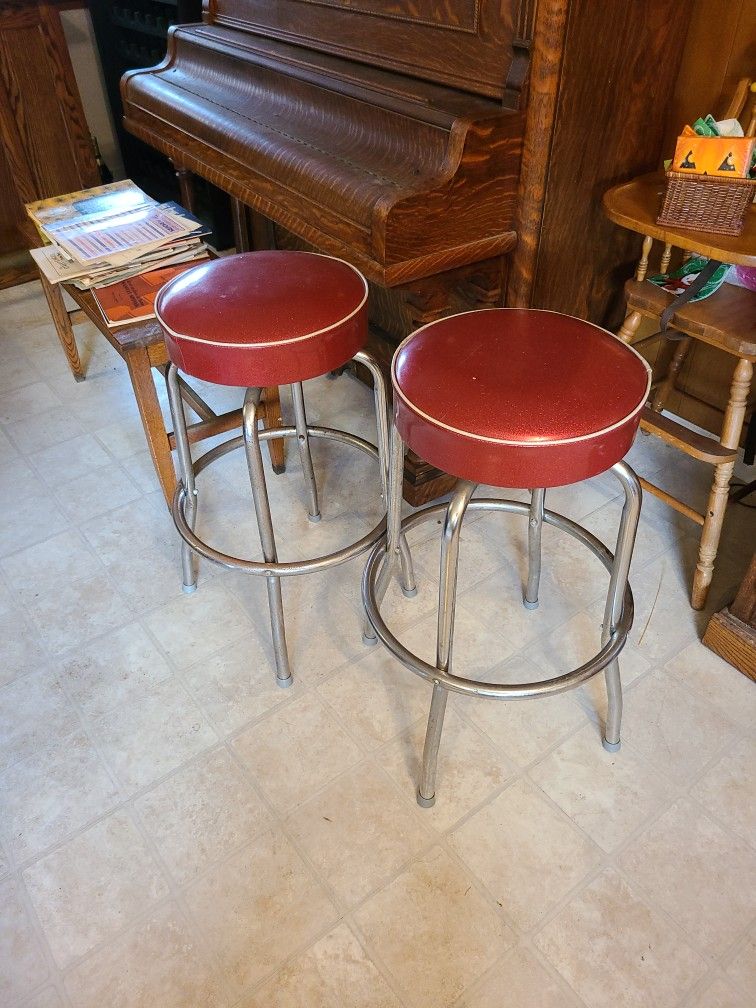 2 RED BAR STOOLS SWIVEL TOP