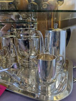 7 pc1960 silver-plated tea and coffee service featuring an ornate tray and unique napkin holder