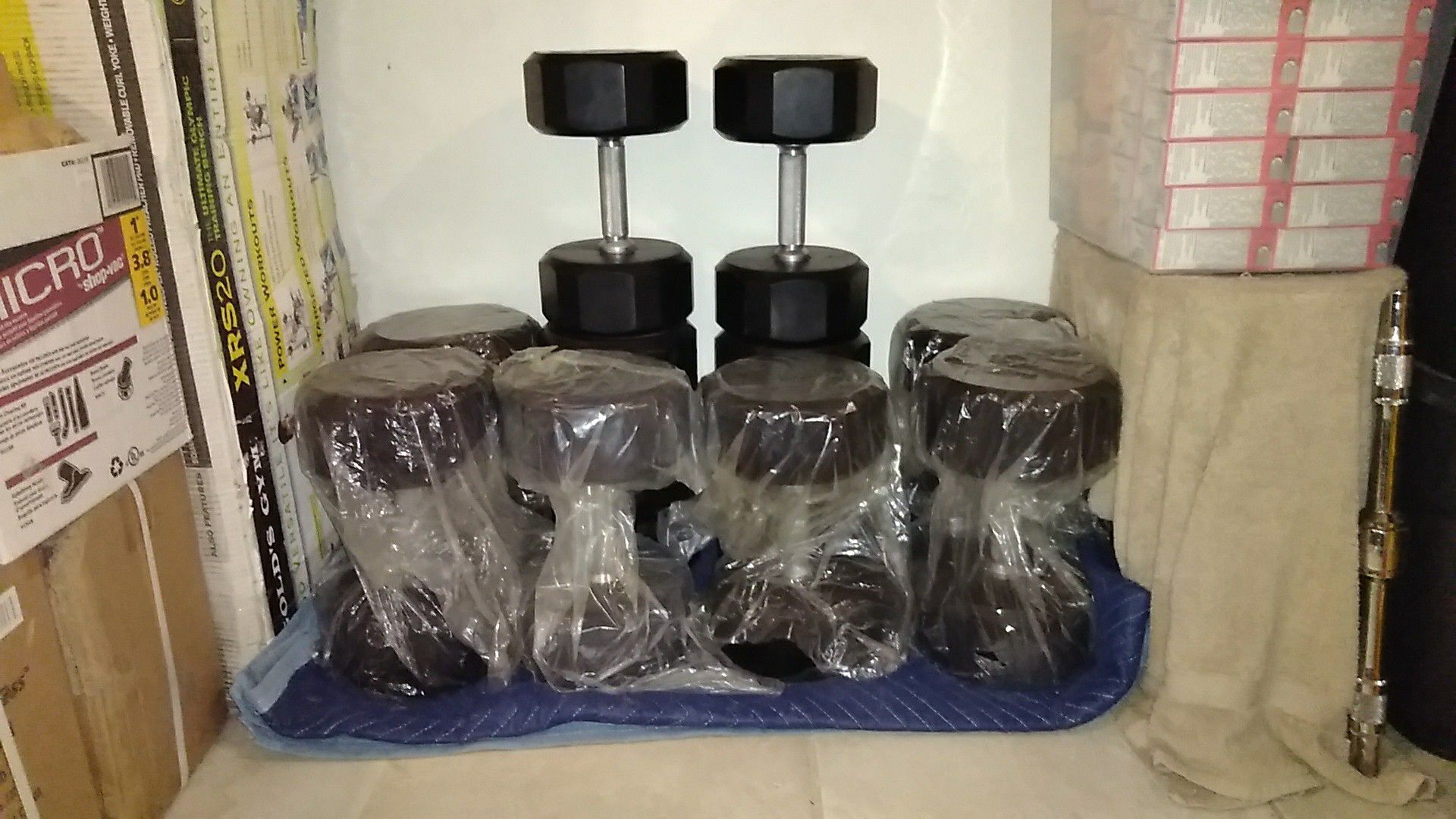 Brand new dumbbells 650 lbs of commercial Troy 12 sided rubber Weights almost $1600 online $1500 OBO never opened my gym so they sit here