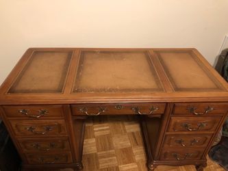 Wood desk.  The measurements are;  54” wide, 26 depth,  31” height. 