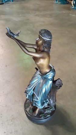 Lady release bird up sculpture