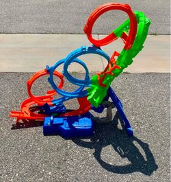 Hot Wheels Action 4-Loop Crash Out Track Set with Motorized Booster & 1:64 Scale