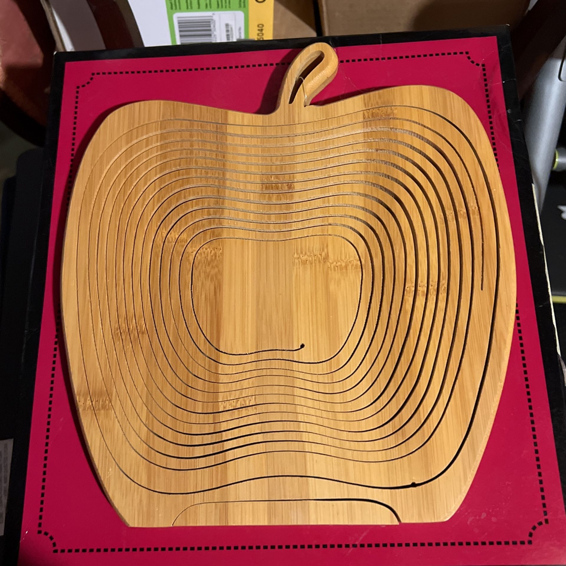 its an apple basket lays flat to be used as a trivet