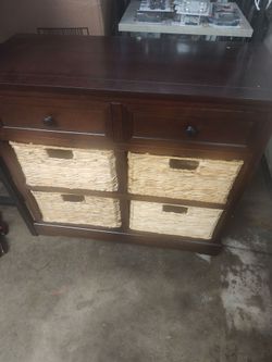 Storage cabinet with baskets