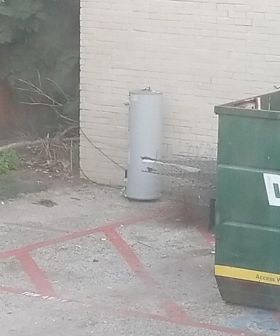 LARGE water Heater by Dumpster 
